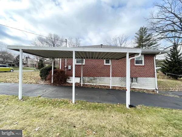 a view of a house with backyard porch and sitting area