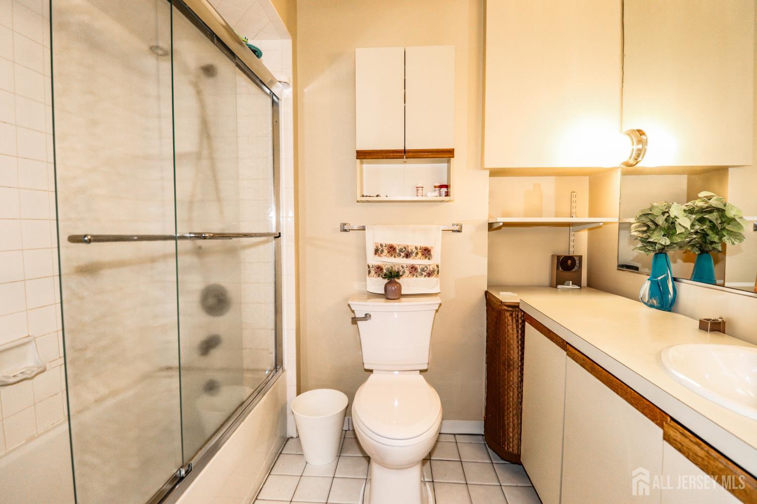 40 Fayette Street, Unit 57 Perth Amboy, NJ 08861 - Photo 23 of 33 a bathroom with a sink a toilet and shower