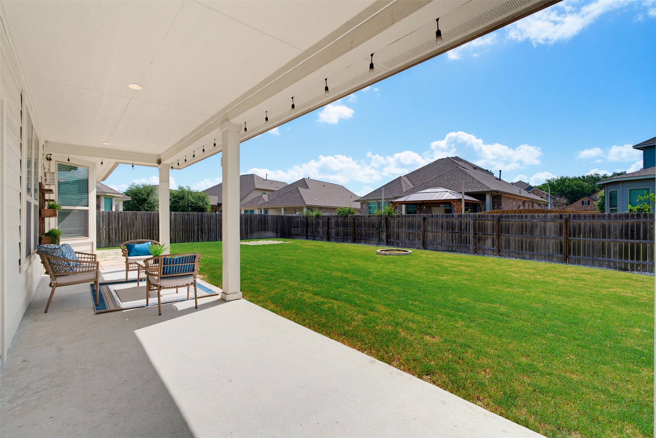 12613 Twisted Root Drive Manchaca, TX 78652 - Photo 16 of 33 A spacious covered patio offers a refreshing outdoor living area, perfect for entertaining.