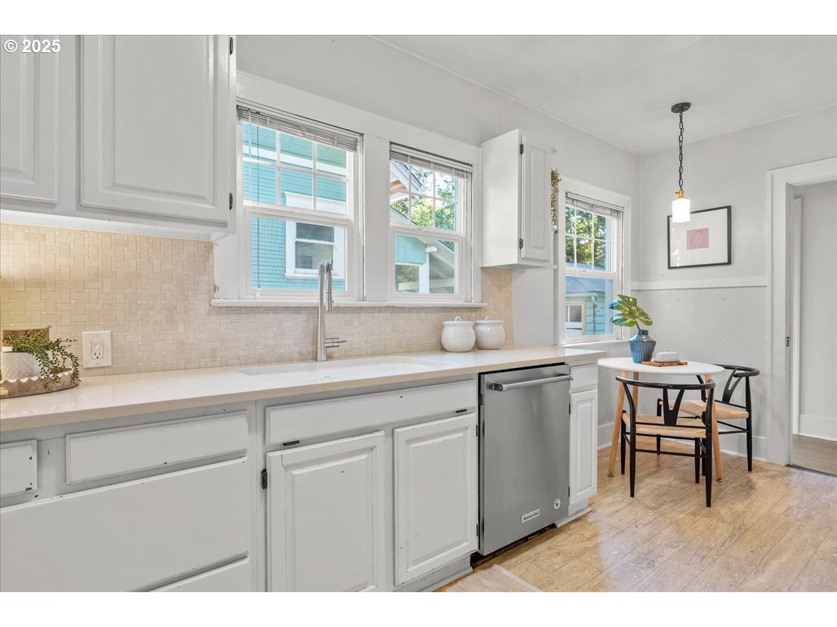 3448 Southeast Sherman Street Portland, OR 97214 - Photo 16 of 40 a kitchen with sink and window