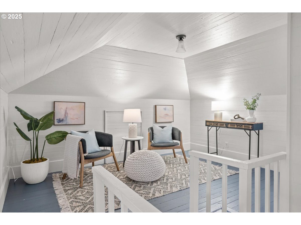 3448 Southeast Sherman Street Portland, OR 97214 - Photo 26 of 40 a living room with furniture and a dining room
