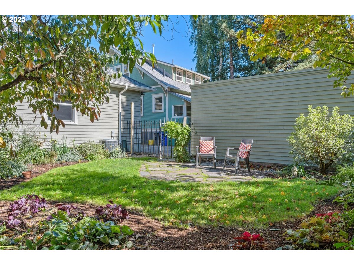 3448 Southeast Sherman Street Portland, OR 97214 - Photo 37 of 40 a view of a house with backyard and sitting area