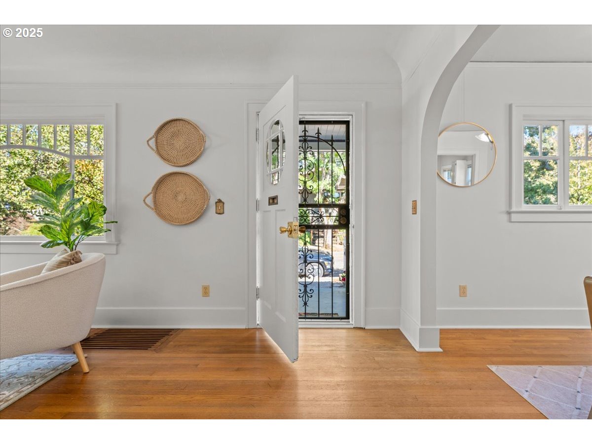 3448 Southeast Sherman Street Portland, OR 97214 - Photo 4 of 40 a view of empty room with wooden floor and fan