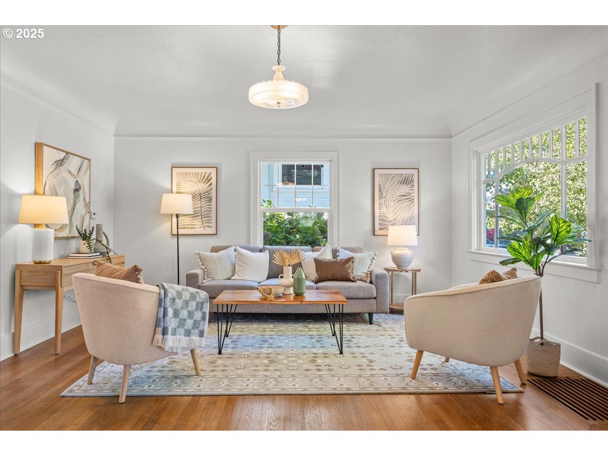 3448 Southeast Sherman Street Portland, OR 97214 - Photo 6 of 40 a living room with furniture and a potted plant