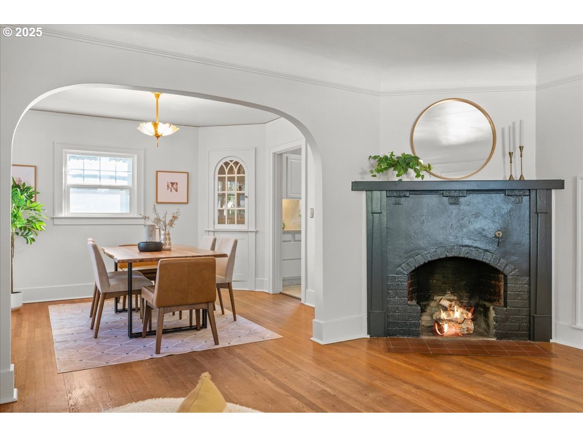 3448 Southeast Sherman Street Portland, OR 97214 - Photo 10 of 40 a living room with furniture and a fireplace
