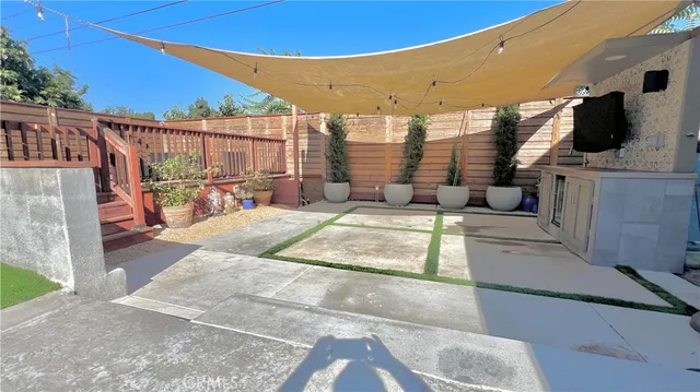 a view of a chairs and table in the patio