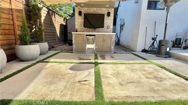 a balcony with couch and chairs