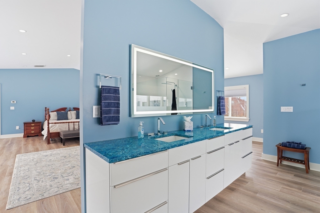 235 Kemp Street Dunstable, MA 01827 - Photo 20 of 42 a spacious bathroom with a granite countertop sink and a mirror