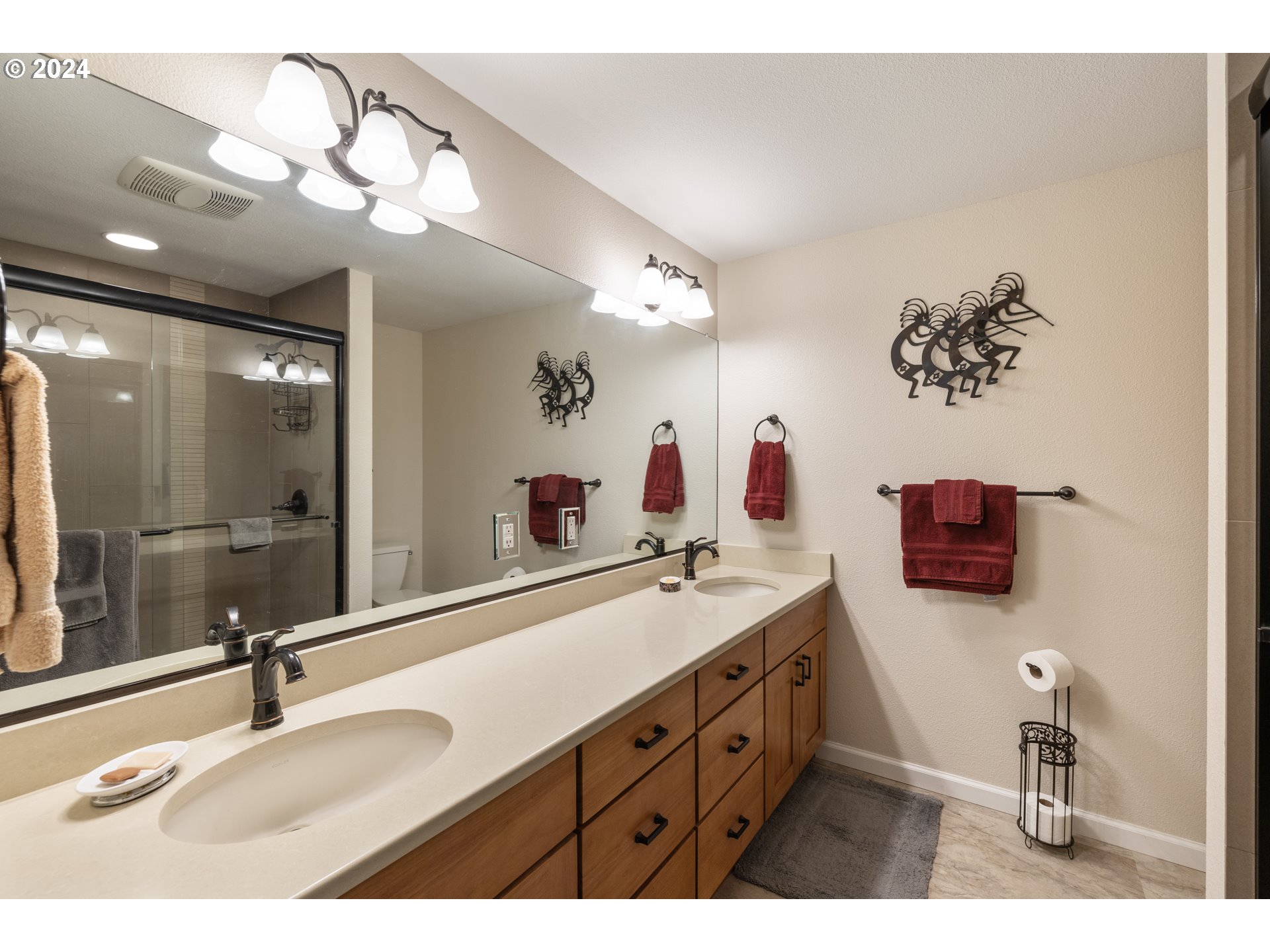 20828 South Mattoon Road Estacada, OR 97023 - Photo 24 of 48 a bathroom with a double vanity sink and a mirror