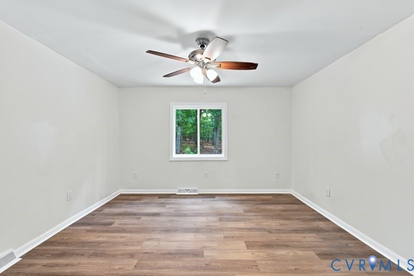 865 Sulphur Spring Road Prospect, VA 23960 - Photo 29 of 40 Spacious room featuring wood-finish flooring, ligh