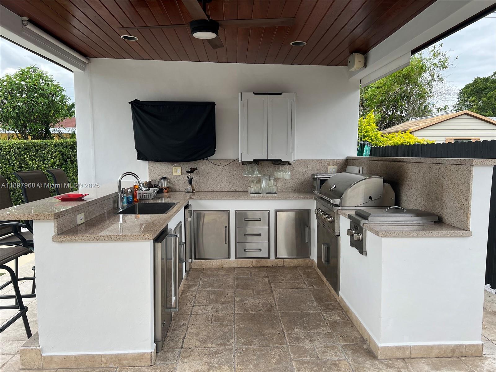 3530 Southwest 126th Avenue Miami, FL 33175 - Photo 13 of 58 a kitchen with a stove and a white refrigerator