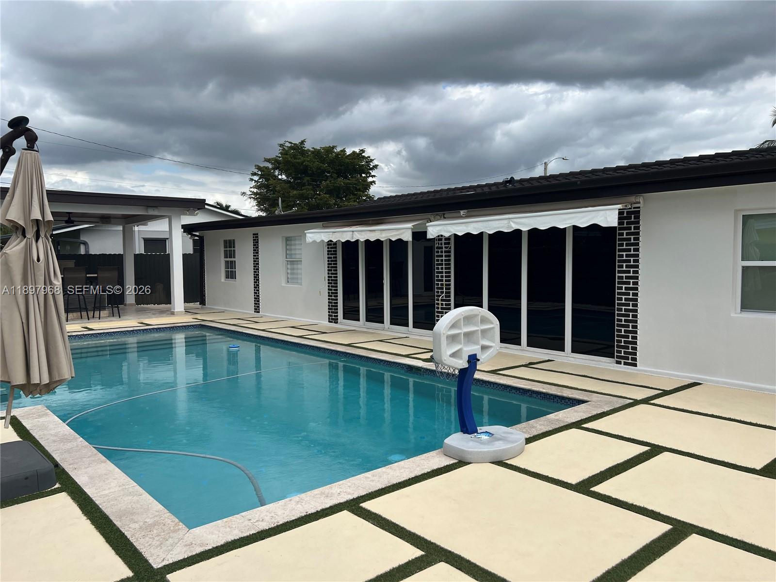 3530 Southwest 126th Avenue Miami, FL 33175 - Photo 14 of 52 a view of swimming pool with a lounge chairs