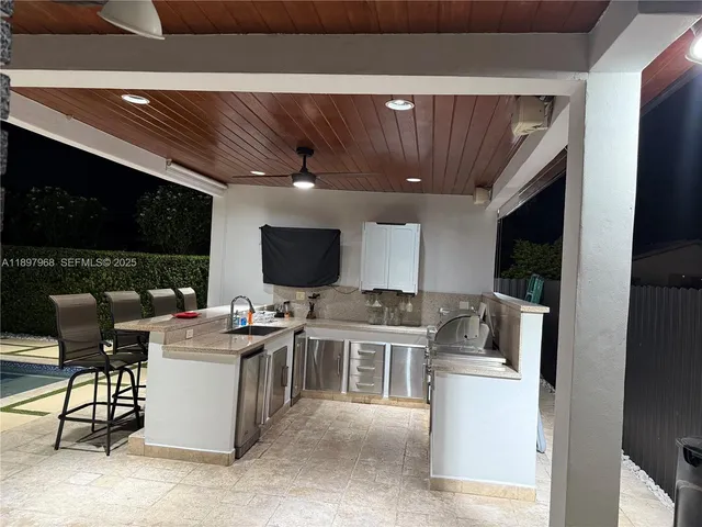 a view of a swimming pool with a yard