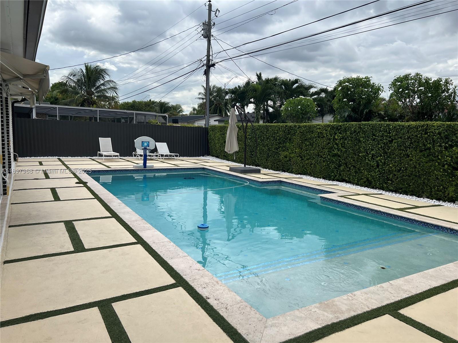 3530 Southwest 126th Avenue Miami, FL 33175 - Photo 19 of 58 a view of a swimming pool with a yard