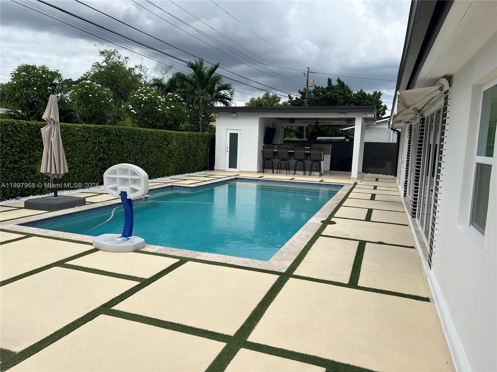 3530 Southwest 126th Avenue Miami, FL 33175 - Photo 21 of 58 a view of swimming pool with seating space and hardwood floor