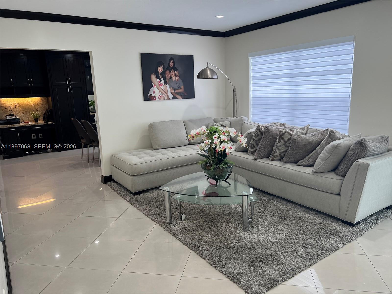 3530 Southwest 126th Avenue Miami, FL 33175 - Photo 23 of 52 a living room with furniture and a flat screen tv