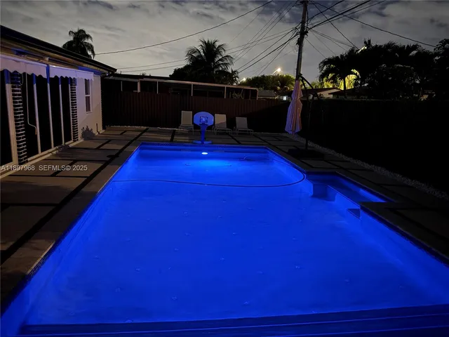 a bedroom with a bed and a mirror
