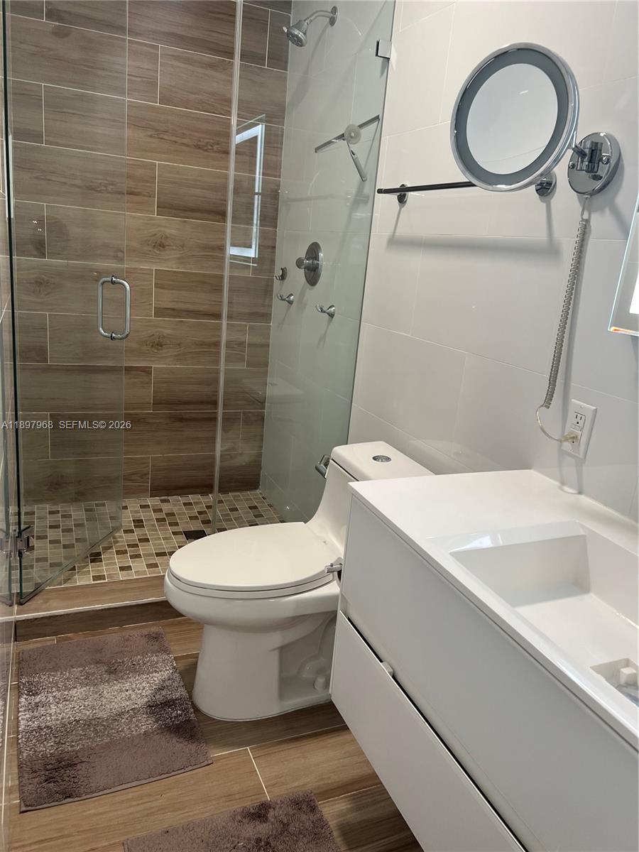 3530 Southwest 126th Avenue Miami, FL 33175 - Photo 28 of 52 a white toilet sitting next to a bathroom sink