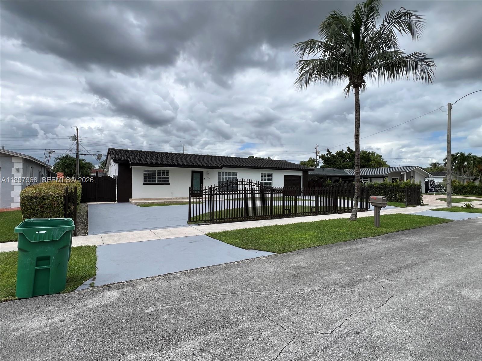 3530 Southwest 126th Avenue Miami, FL 33175 - Photo 3 of 52 a front view of house with yard and green space