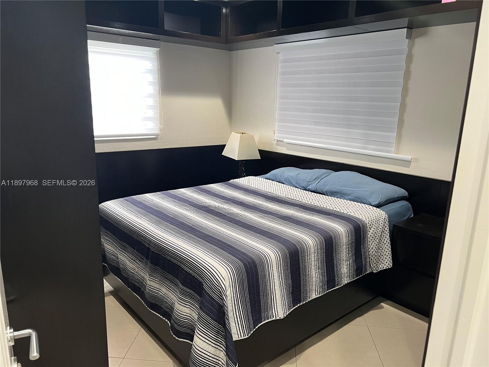 3530 Southwest 126th Avenue Miami, FL 33175 - Photo 32 of 52 a bedroom with a bed and window