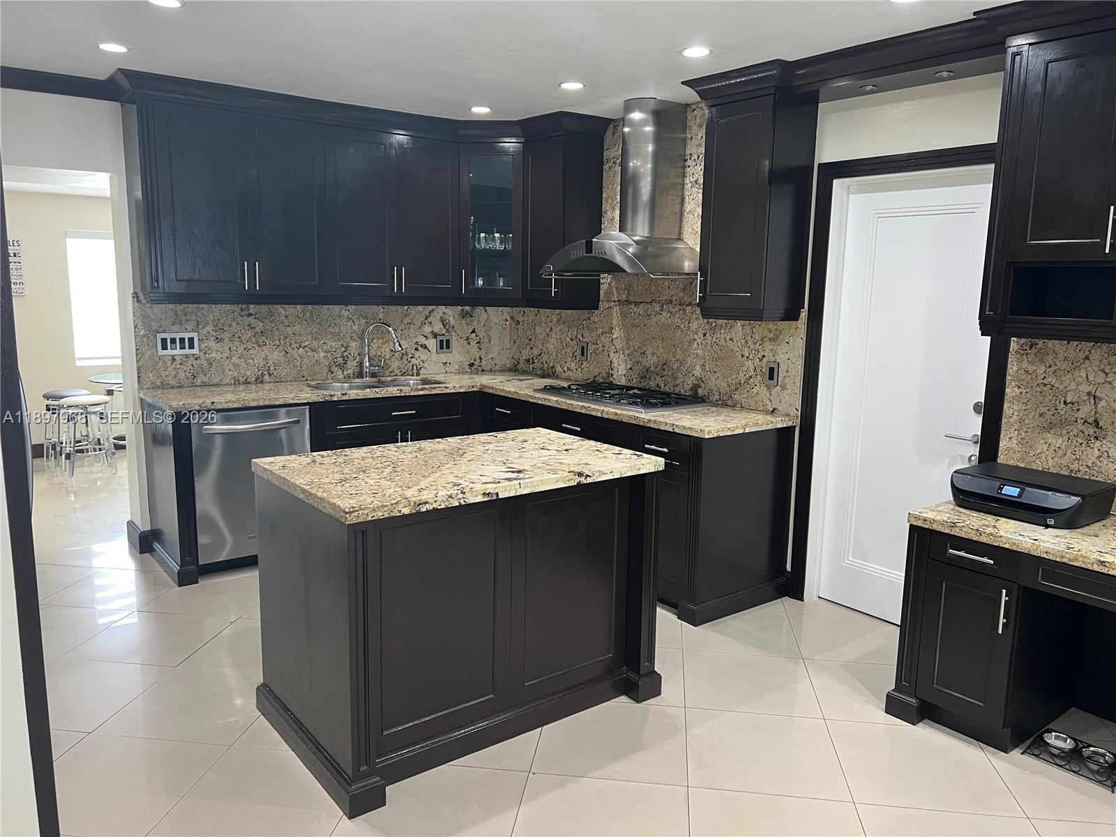 3530 Southwest 126th Avenue Miami, FL 33175 - Photo 37 of 52 a kitchen with a sink stove and cabinets
