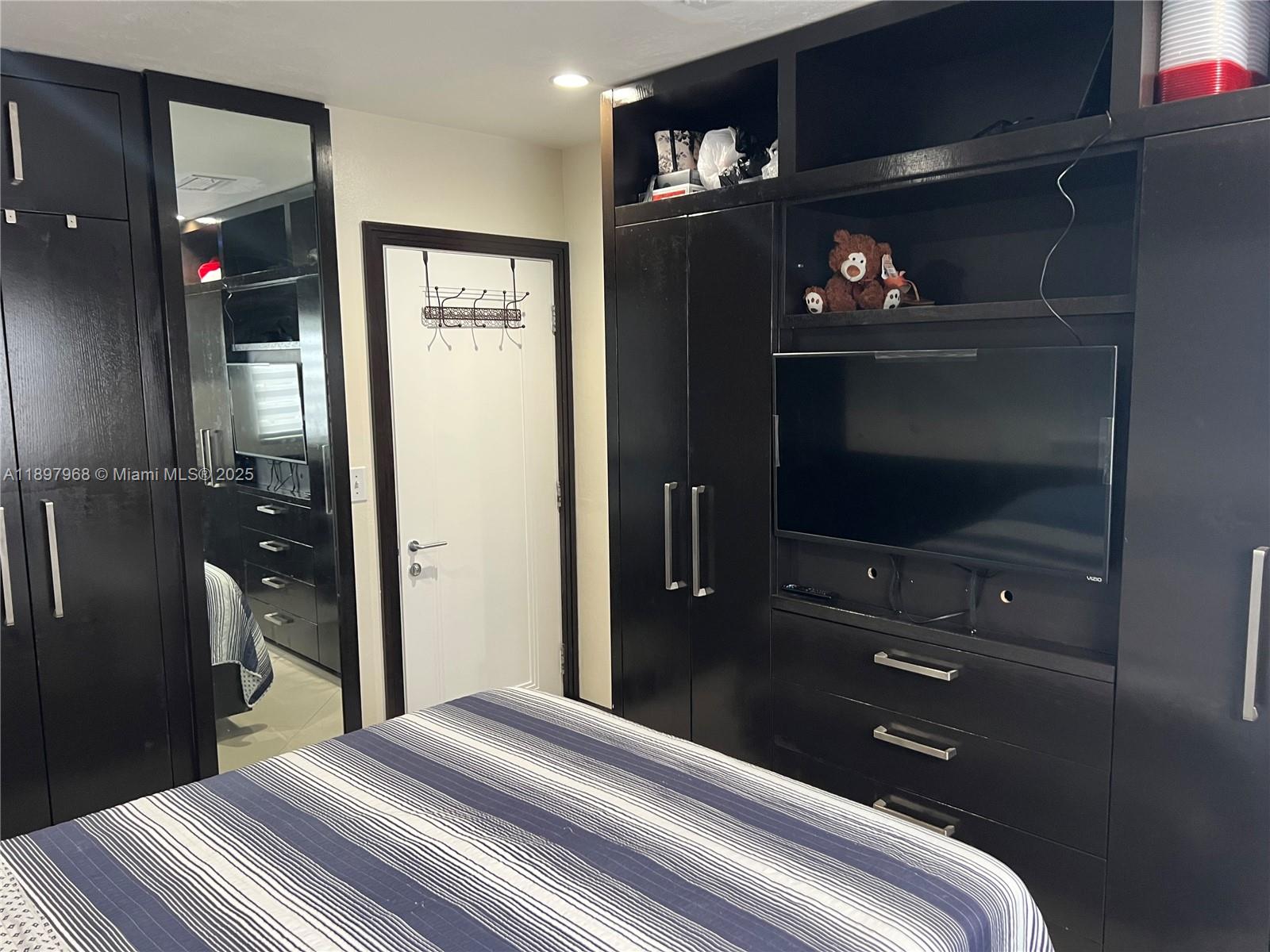 3530 Southwest 126th Avenue Miami, FL 33175 - Photo 39 of 58 a bedroom with a bed and a television