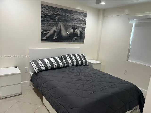 a view of a dining room with furniture and window