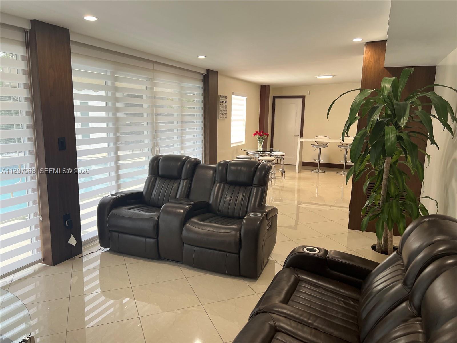 3530 Southwest 126th Avenue Miami, FL 33175 - Photo 43 of 52 a living room with furniture and a large window