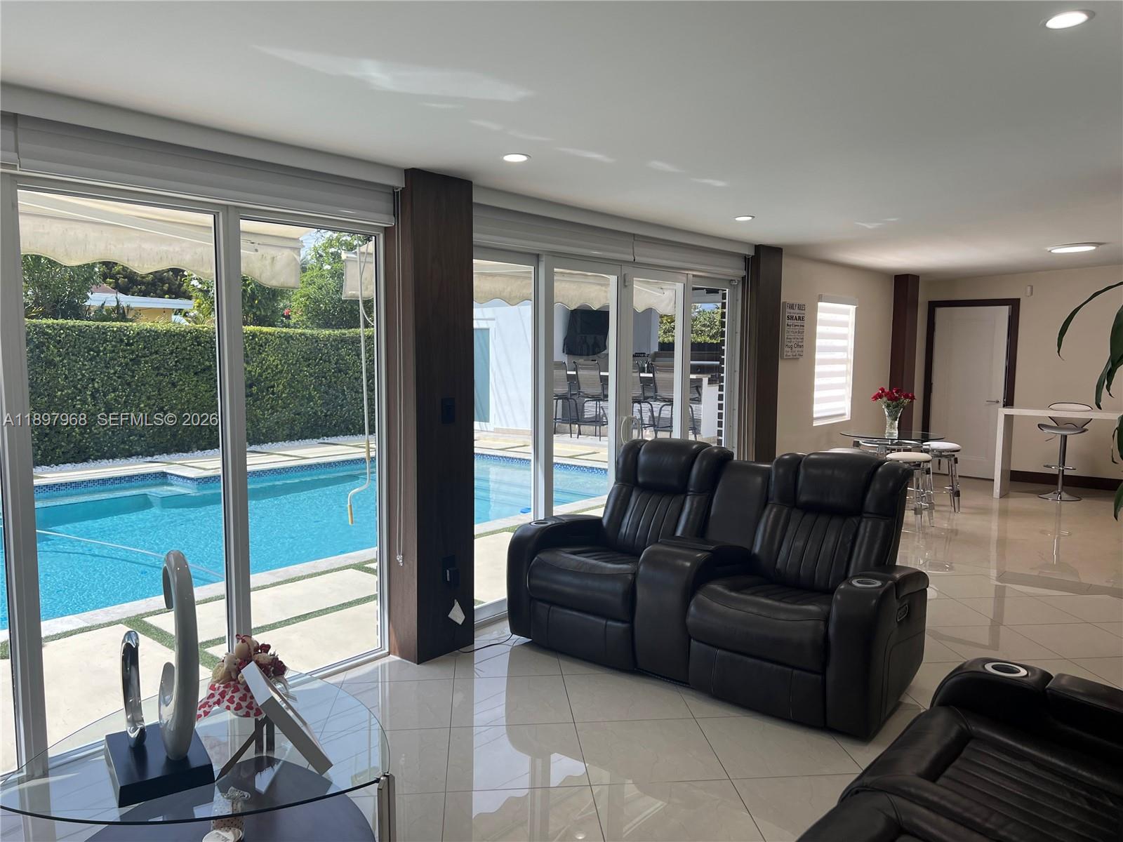 3530 Southwest 126th Avenue Miami, FL 33175 - Photo 49 of 52 a living room with furniture and a floor to ceiling window