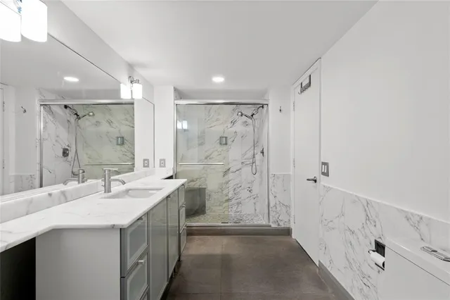 a view of storage and utility room with washer and dryer