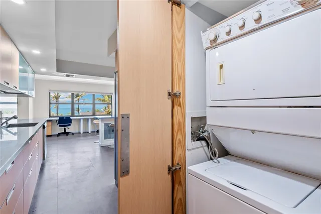 a room with furniture pool table wooden floor and windows