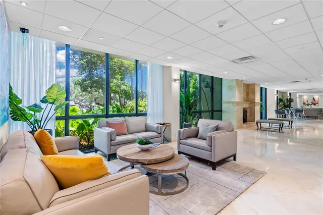 a view of a tennis ground with large trees