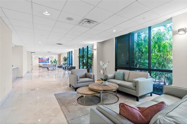 a view of parking garage with cars parked