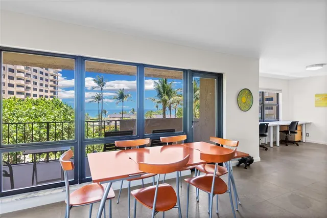 a view of a dining room with furniture window and outside view