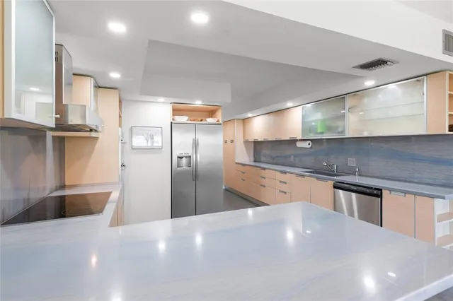 a kitchen with sink and stove