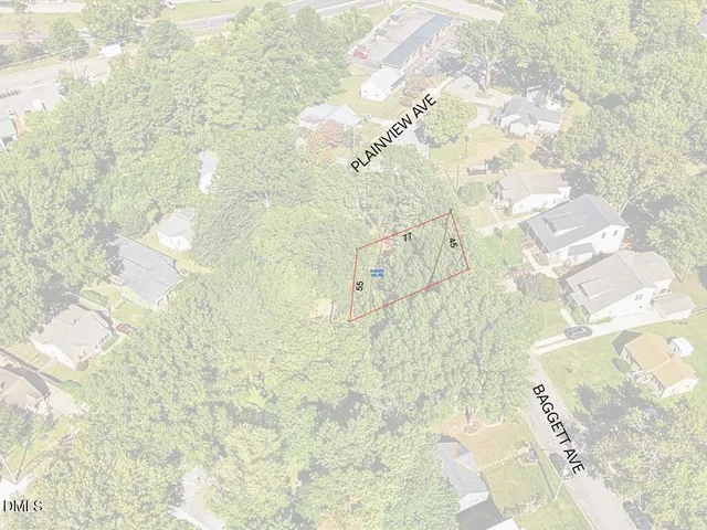 an aerial view of residential houses with yard