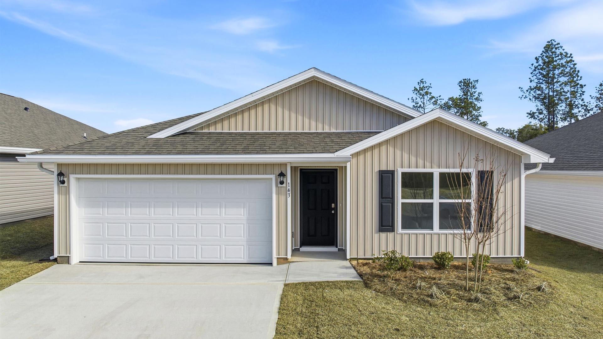 a front view of a house with a garage