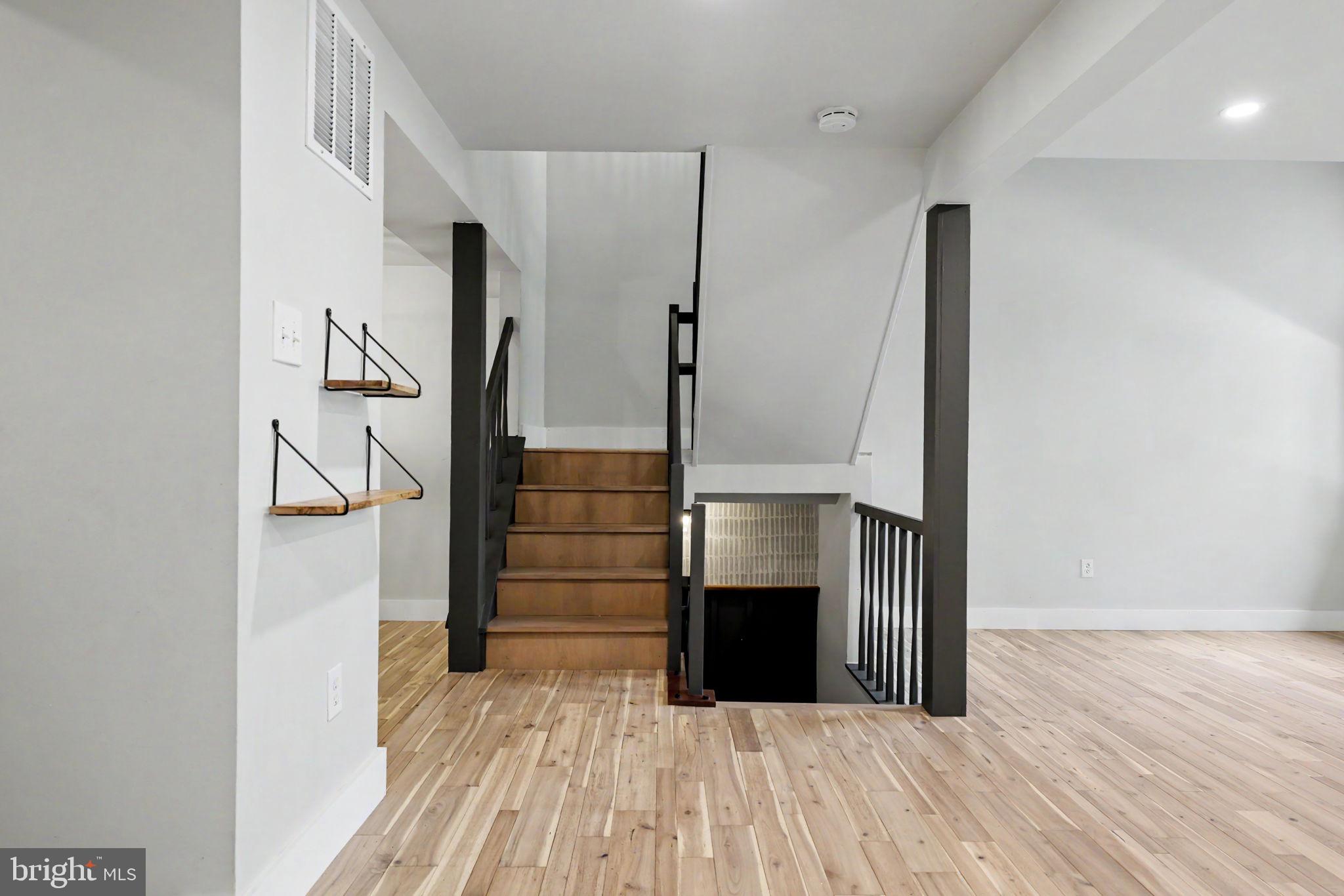 2105 Glencourse Lane Reston, VA 20191 - Photo 61 of 74 Main level stairway transition
