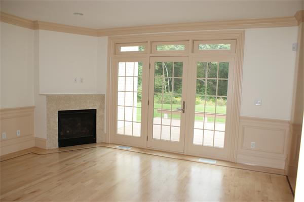 237 Rice Road Wayland, MA 01778 - Photo 3 of 5 a view of an empty room with a window and fireplace
