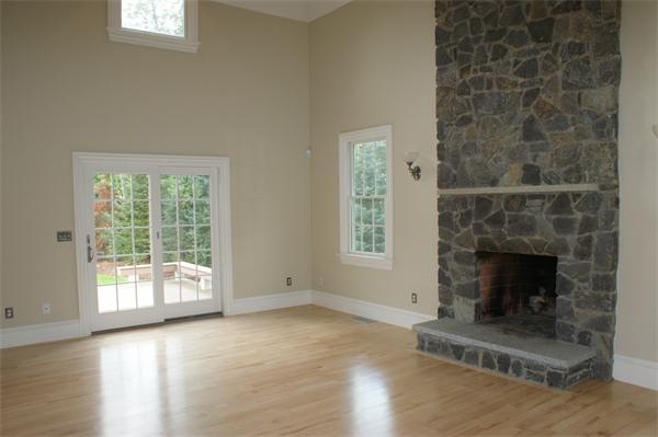 237 Rice Road Wayland, MA 01778 - Photo 4 of 5 an empty room with fireplace and windows