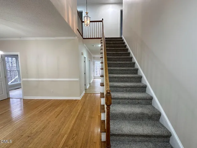 a view of an entryway with wooden floor