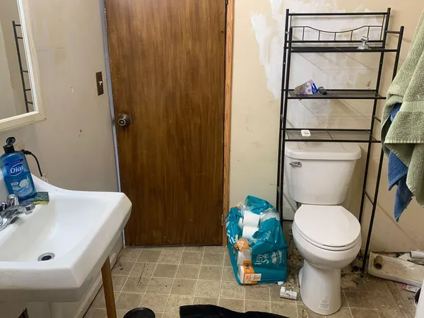 a bathroom with a sink and a toilet