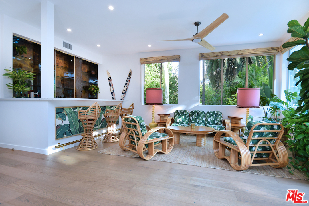 3848 Fredonia Drive Los Angeles, CA 90068 - Photo 12 of 23 a living room filled with furniture hardwood floor and a floor to ceiling window