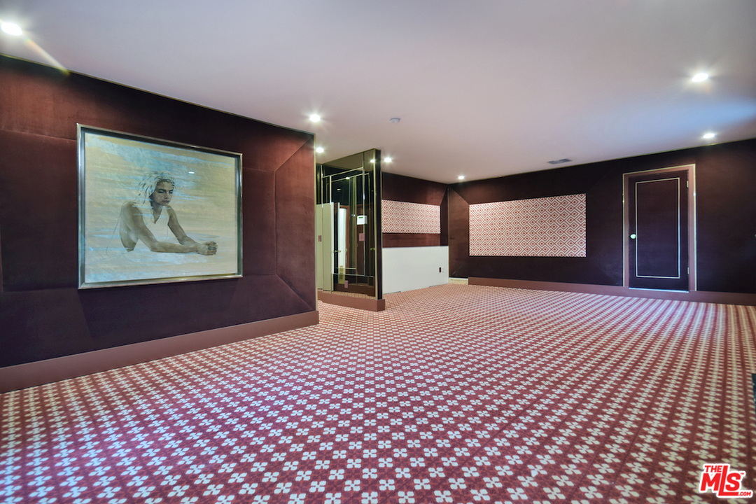 3848 Fredonia Drive Los Angeles, CA 90068 - Photo 15 of 23 a bedroom with a bed and a painting on the wall