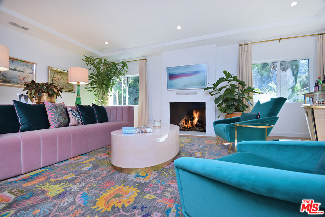 3848 Fredonia Drive Los Angeles, CA 90068 - Photo 3 of 23 a living room with furniture and a fireplace