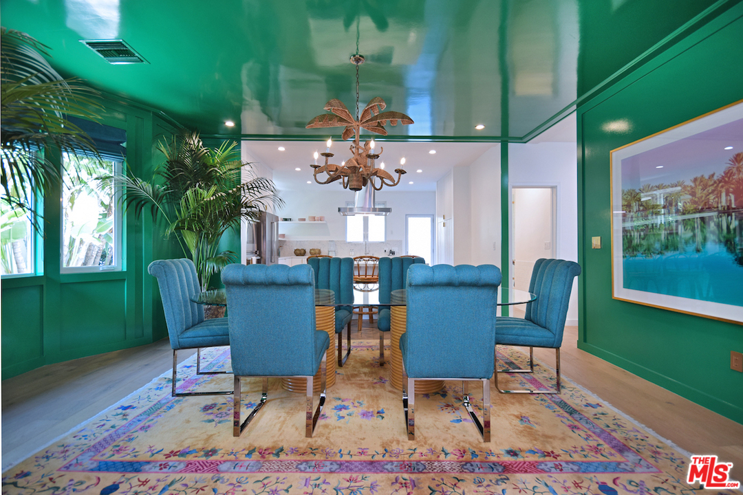 3848 Fredonia Drive Los Angeles, CA 90068 - Photo 5 of 23 a view of a dining room with furniture and chandelier