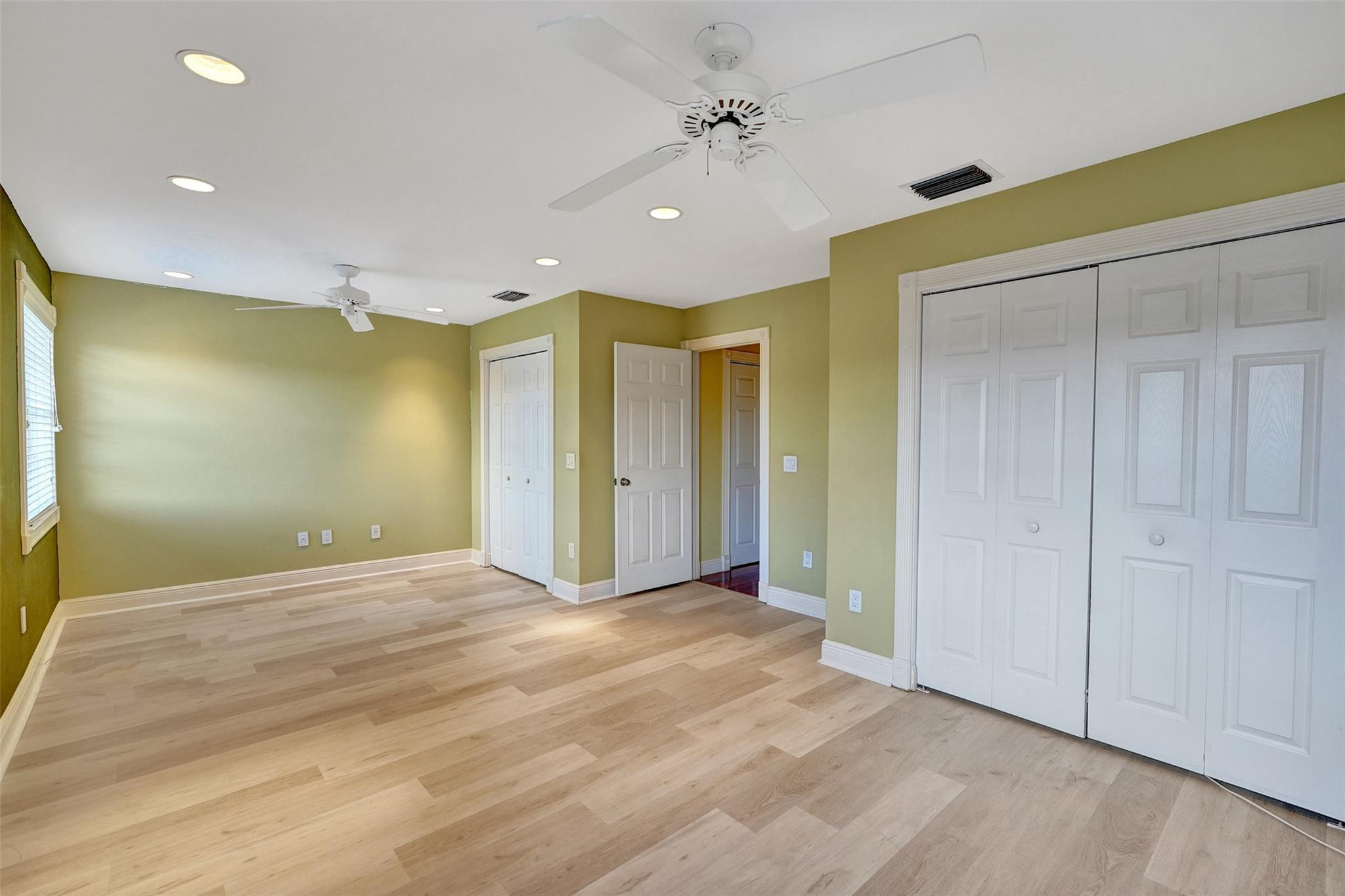 10902 Tamoron Lane Boca Raton, FL 33498 - Photo 47 of 66 a view of empty room with wooden floor