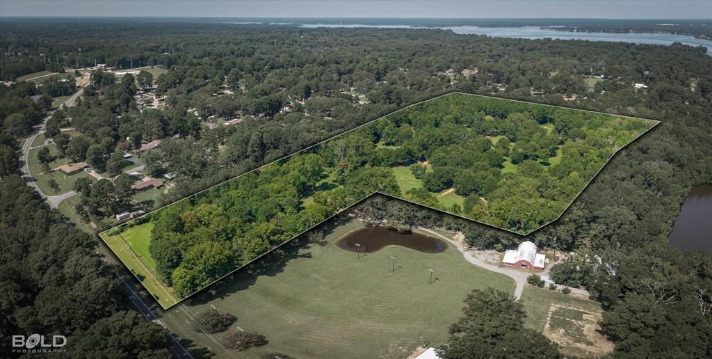 5844 Jefferson Paige Road Shreveport, LA 71119 - Photo 15 of 16 an aerial view of a residential houses covered in trees