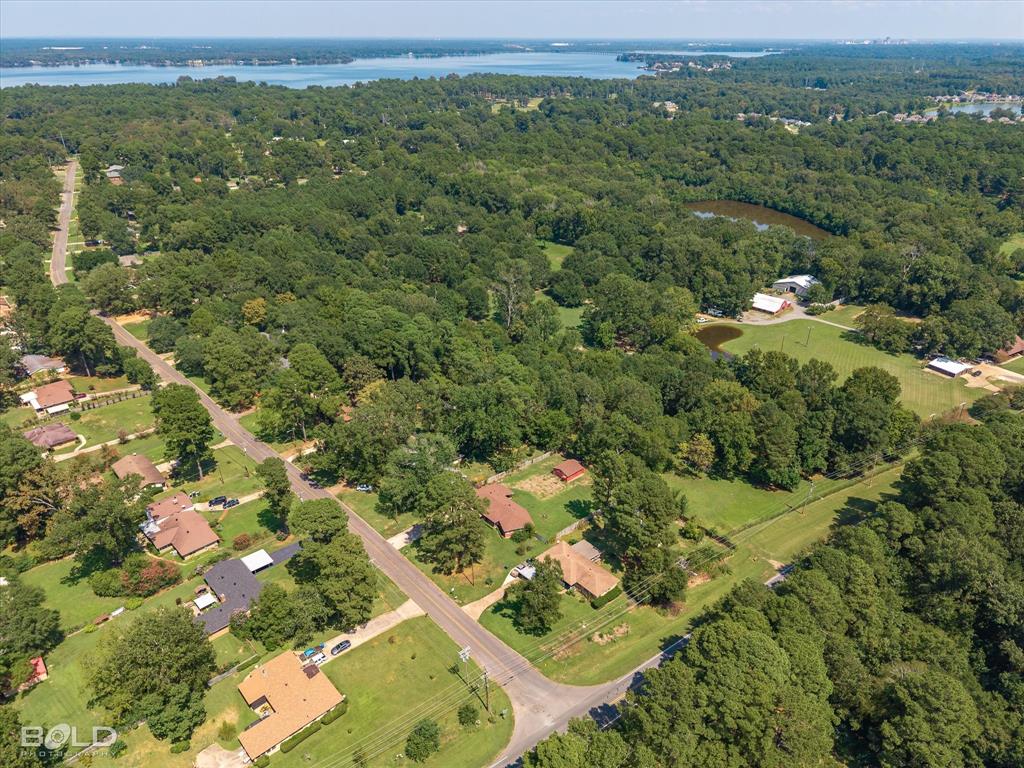 5844 Jefferson Paige Road Shreveport, LA 71119 - Photo 4 of 16 an aerial view of a houses with a lush green hillside
