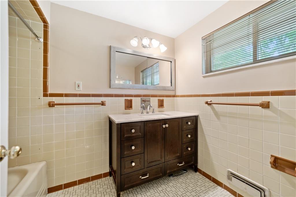127 Church Road Pittsburgh, PA 15209 - Photo 15 of 35 a bathroom with a sink and a mirror